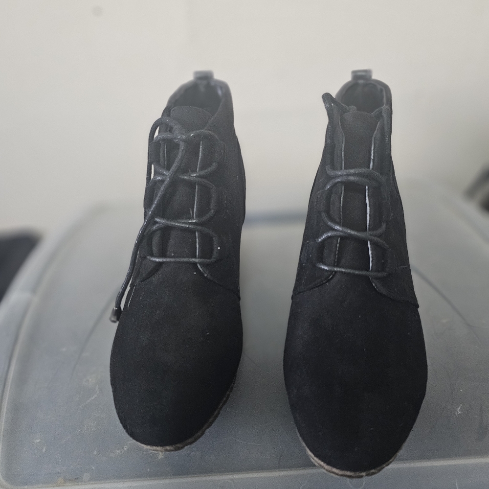 Sleek Black Lace Up Boots with Unique Lacing System and Soft Fabric